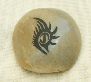 A stone with the graphic of your loved one's tattoo. Perfect everlasting keepsake.